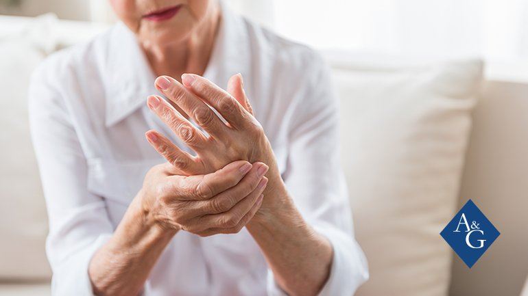 Woman holding her hand