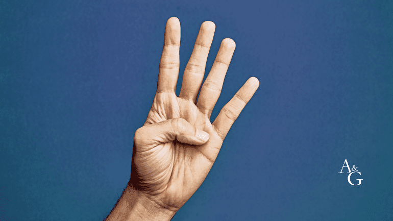 Hand showing the number 4